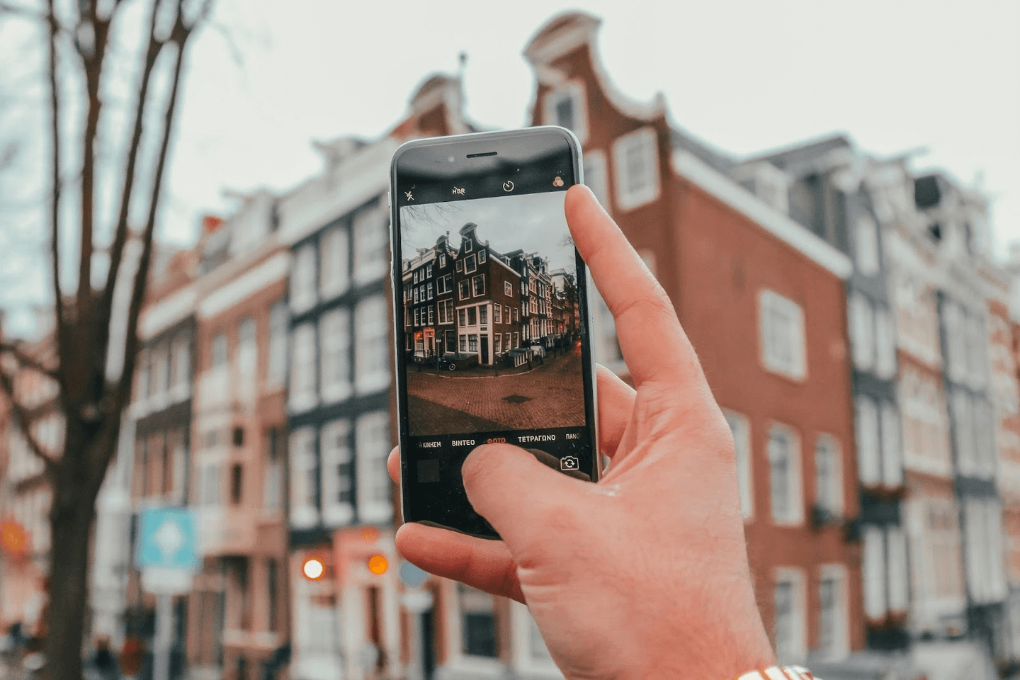 Real estate agent taking property photos with a smartphone
